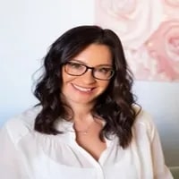 Raeanne_Lacatena seen with shoulder length hair style and in a white color outfit